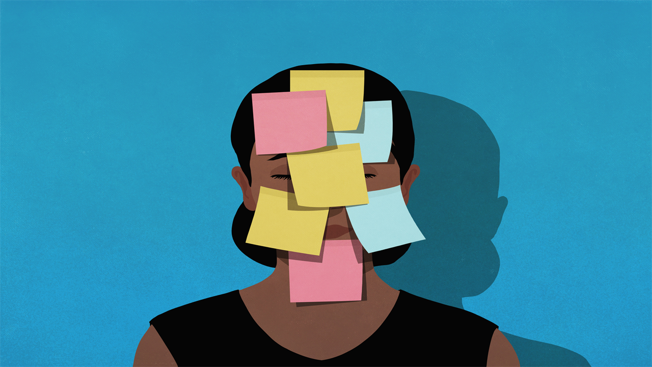 Adhesive notes covering face of exhausted woman