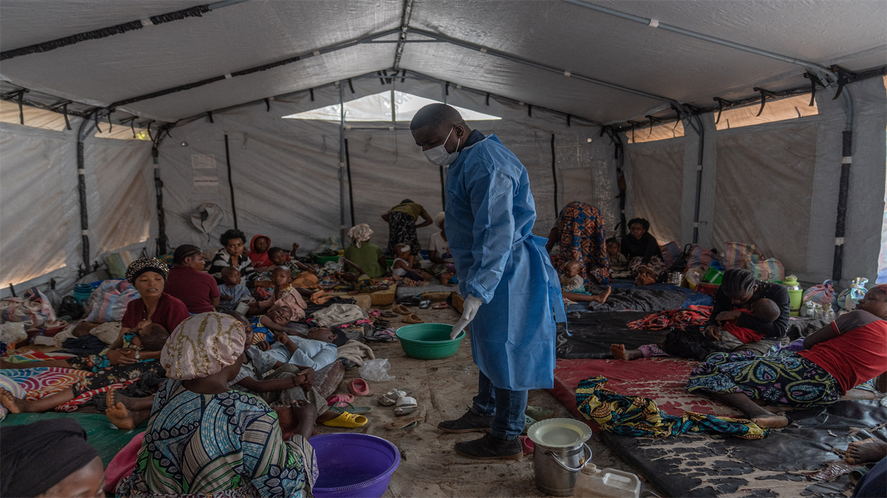 Doctor Robert Musole, medical director of the Kavumu hospital, visits patients recovering from mpox in the village of Kavumu, in eastern Democratic Republic of Congo on Aug. 24, 2024.